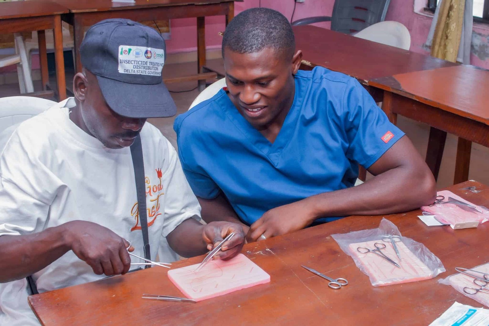 Mr Obalponovwe teaching skin stitching skills